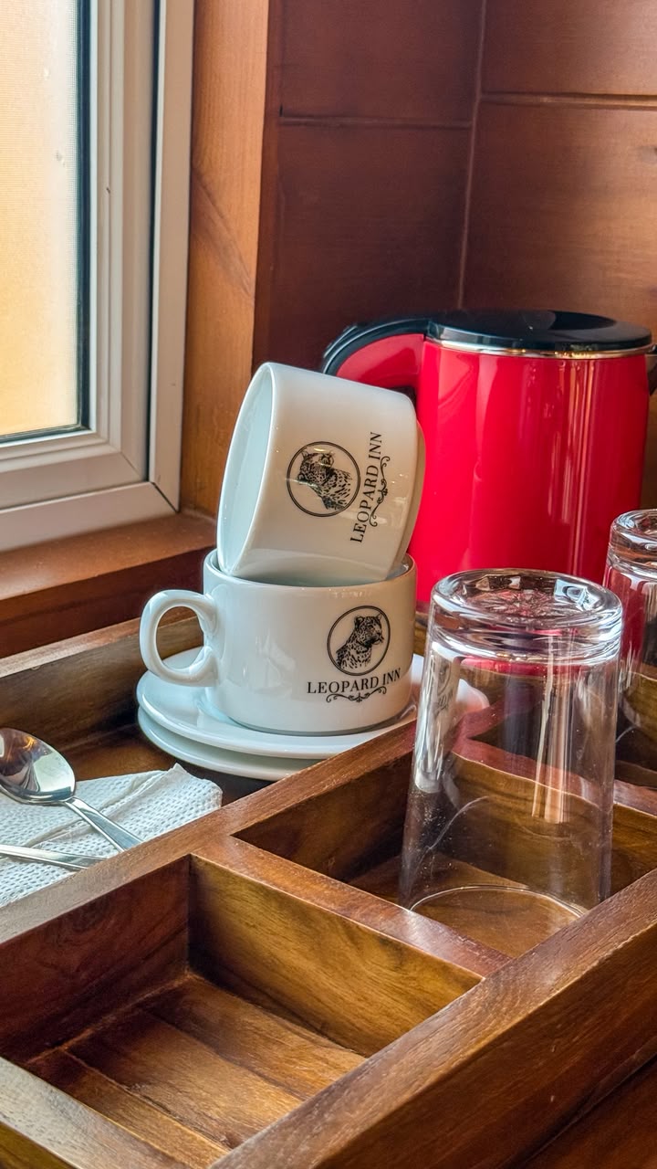 Leopard Inn branded coffee cups